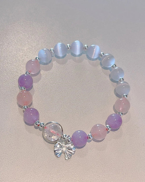 Bransoletka z kryształami imitującymi oko kota w kształcie motyla