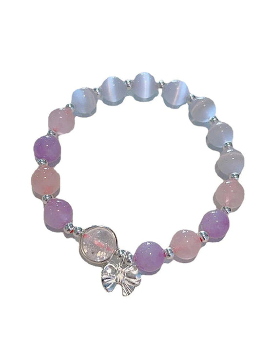 Bransoletka z kryształami imitującymi oko kota w kształcie motyla