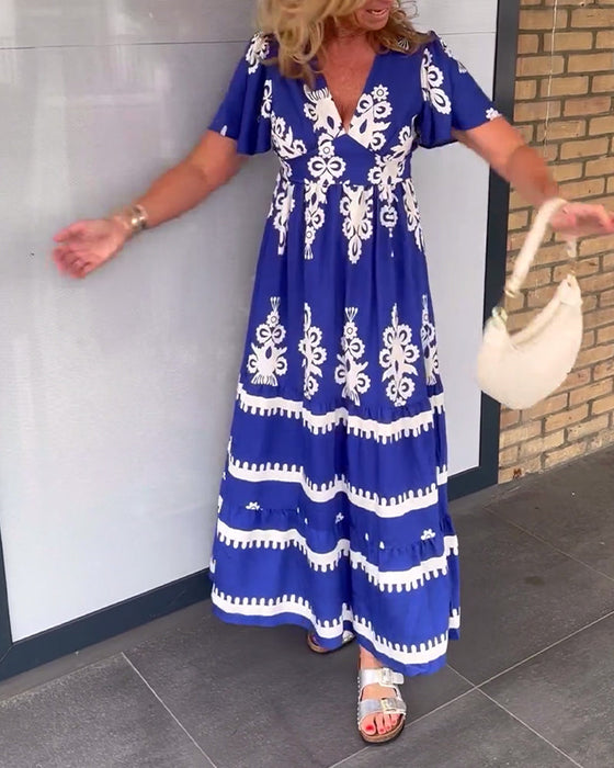 Elegancka długa sukienka w stylu vintage z dekoltem w kształcie litery V