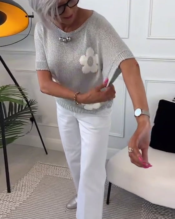 Wąski sweterek w kwiaty z okrągłym dekoltem