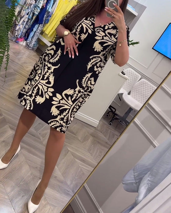 Luźna sukienka w stylu retro z dekoltem w kształcie litery V i krótkim rękawem