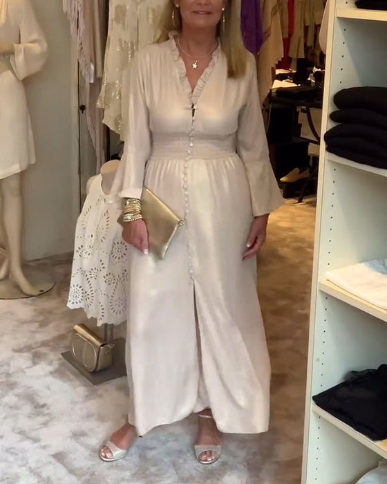 Długa sukienka zapinana na guziki z koronkowym kołnierzykiem