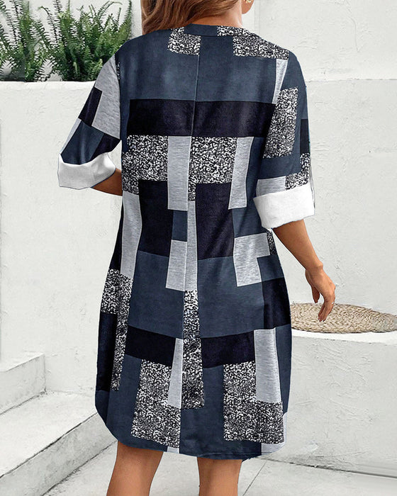 Sukienka w kratę zapinana na guziki