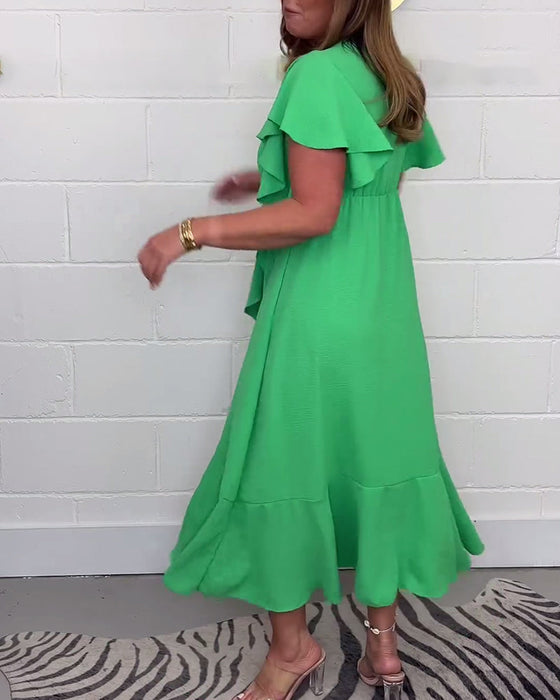 Elegancka sukienka z rozcięciem w jednolitym kolorze