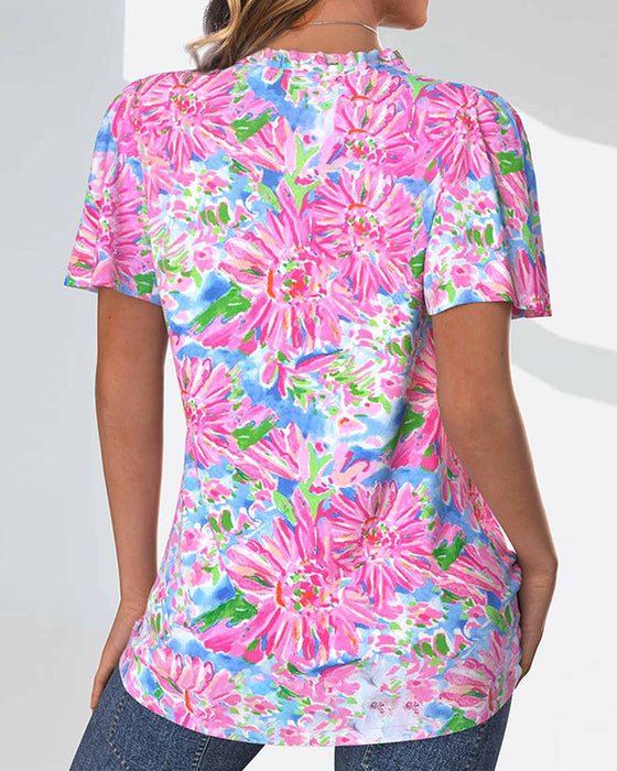 Bluzka z krótkim rękawkiem w kwiaty i guziki