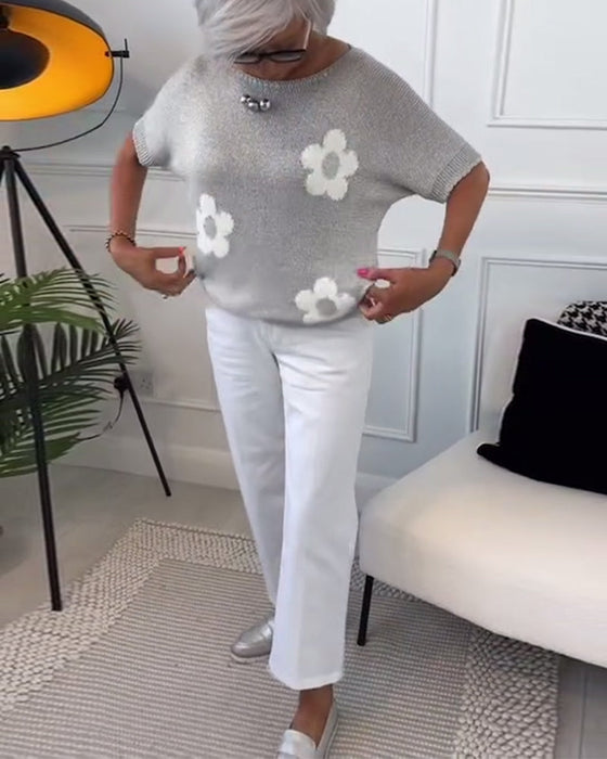 Wąski sweterek w kwiaty z okrągłym dekoltem