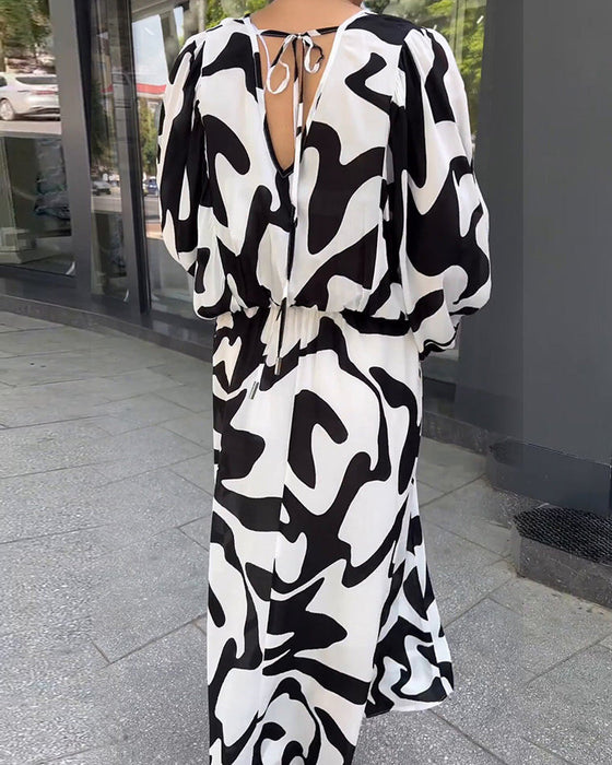 Elegancka sukienka z długimi rękawami w modny wzór