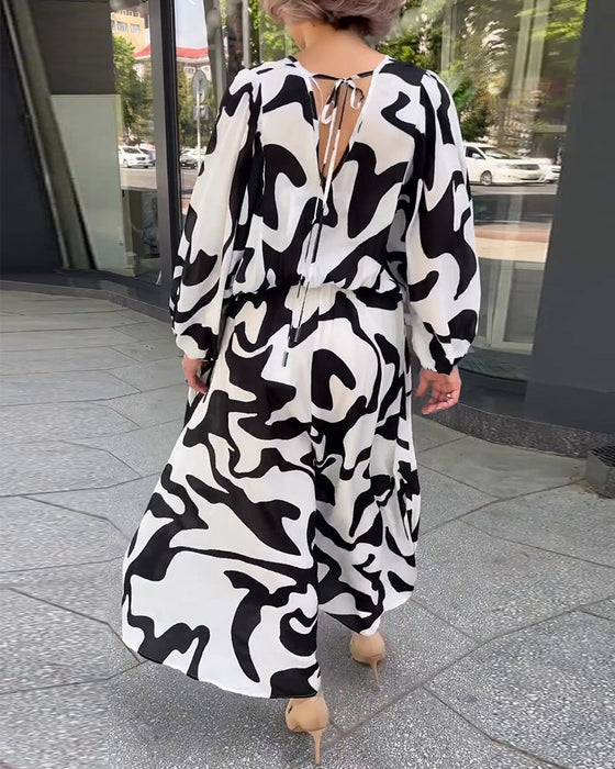 Elegancka sukienka z długimi rękawami w modny wzór