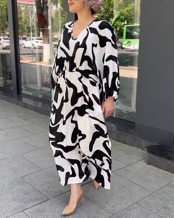 Elegancka sukienka z długimi rękawami w modny wzór