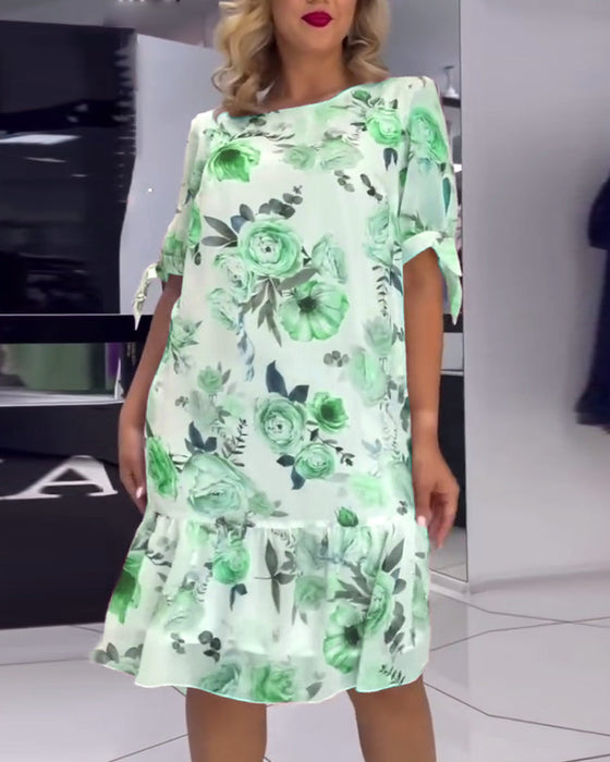 Elegancka sukienka w kwiaty z okrągłym dekoltem