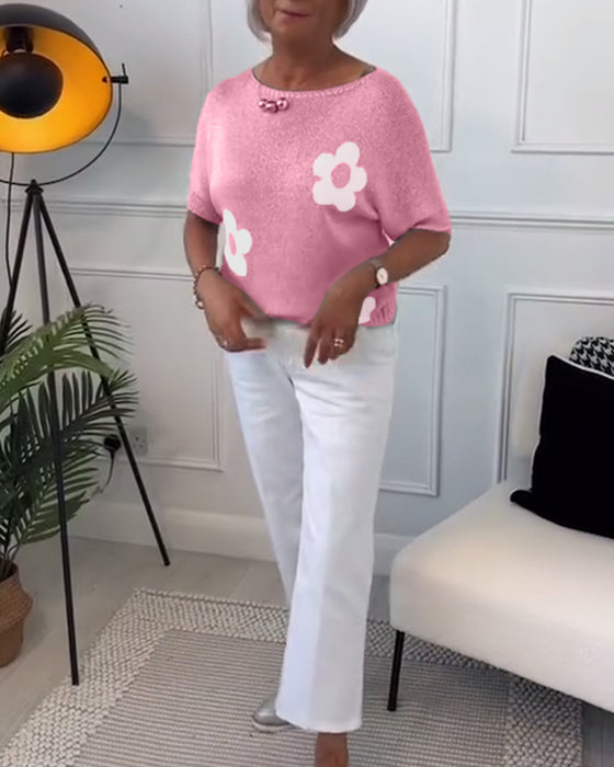 Wąski sweterek w kwiaty z okrągłym dekoltem