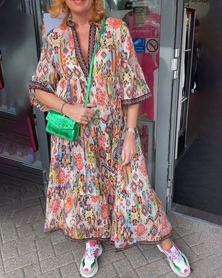 Elegancka długa sukienka z dekoltem w serek