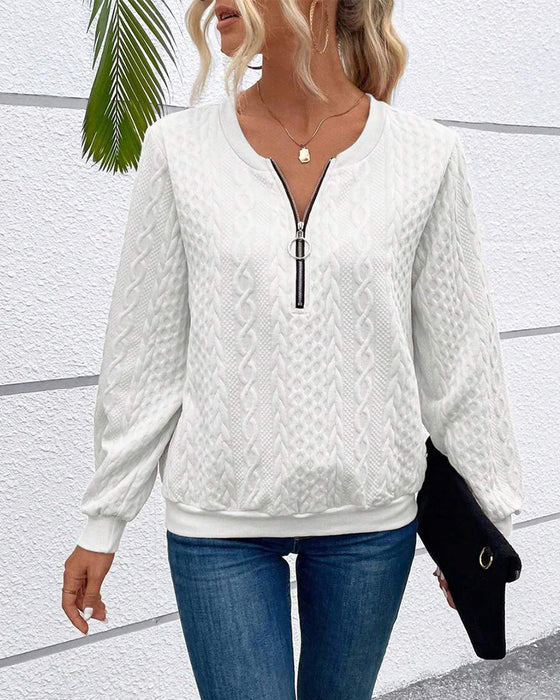 Luźna jednokolorowa bluza z długim rękawem i zamkiem błyskawicznym