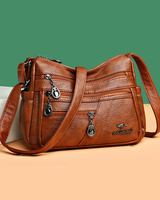 Wielokieszeniowa miękka skórzana torebka na ramię (crossbody)