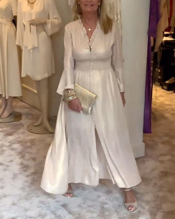 Długa sukienka zapinana na guziki z koronkowym kołnierzykiem