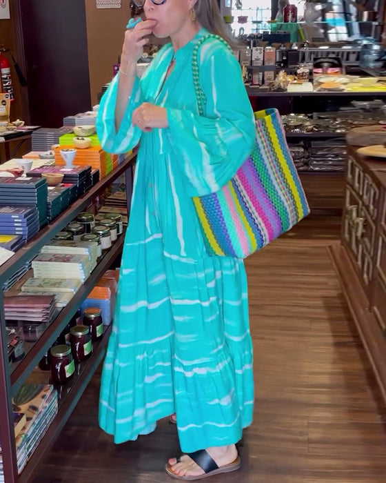 Luźna długa sukienka z dekoltem w kształcie litery V z rozszerzanymi rękawami