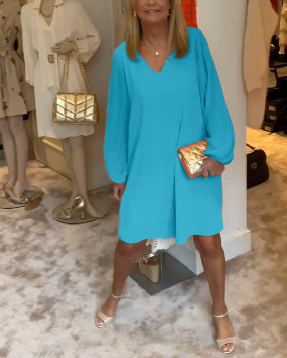 Sukienka w jednolitym kolorze z rękawami typu lampion i dekoltem w kształcie litery V