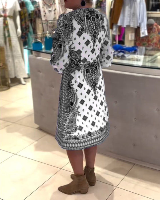 Elegancka sukienka midi z dekoltem w kształcie litery V