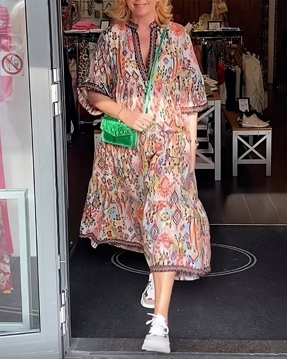 Elegancka długa sukienka z dekoltem w serek