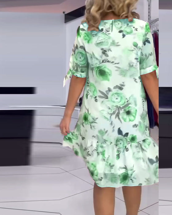 Elegancka sukienka w kwiaty z okrągłym dekoltem