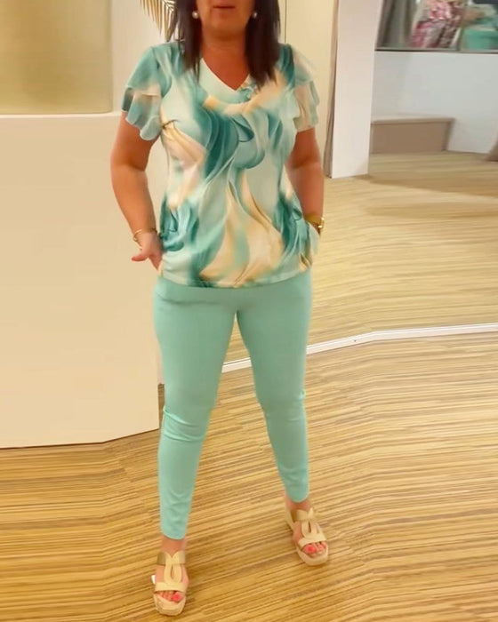 Patchworkowa bluzka z falbankami i nadrukiem z dekoltem w kształcie litery V