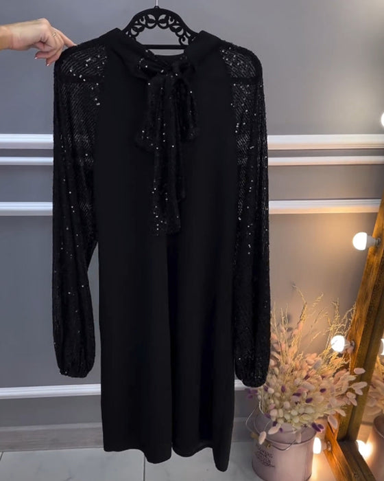 Sukienka w jednolitym kolorze z wstawkami na rękawach