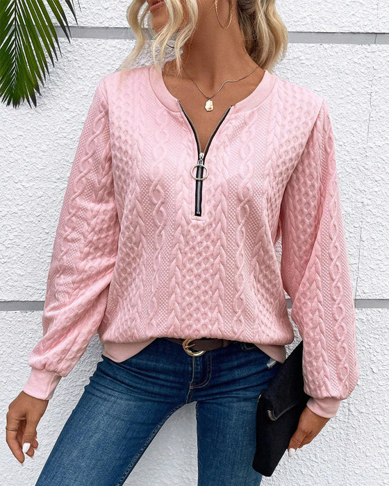 Luźna jednokolorowa bluza z długim rękawem i zamkiem błyskawicznym