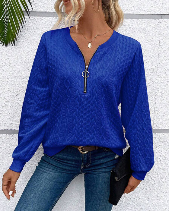 Luźna jednokolorowa bluza z długim rękawem i zamkiem błyskawicznym