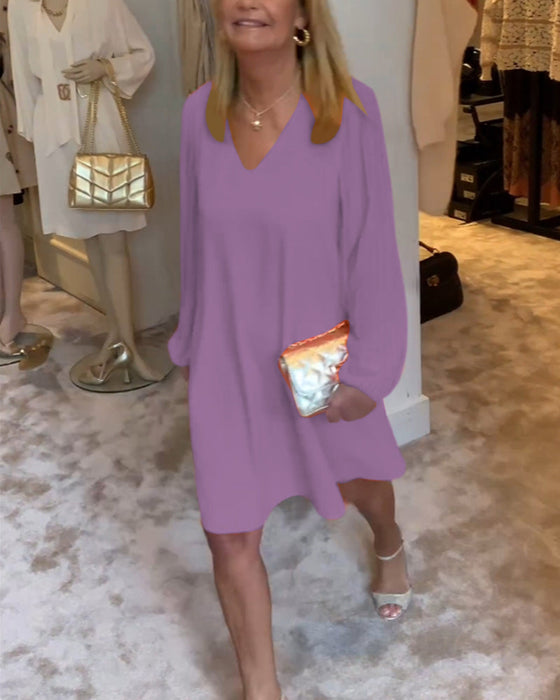 Sukienka w jednolitym kolorze z rękawami typu lampion i dekoltem w kształcie litery V