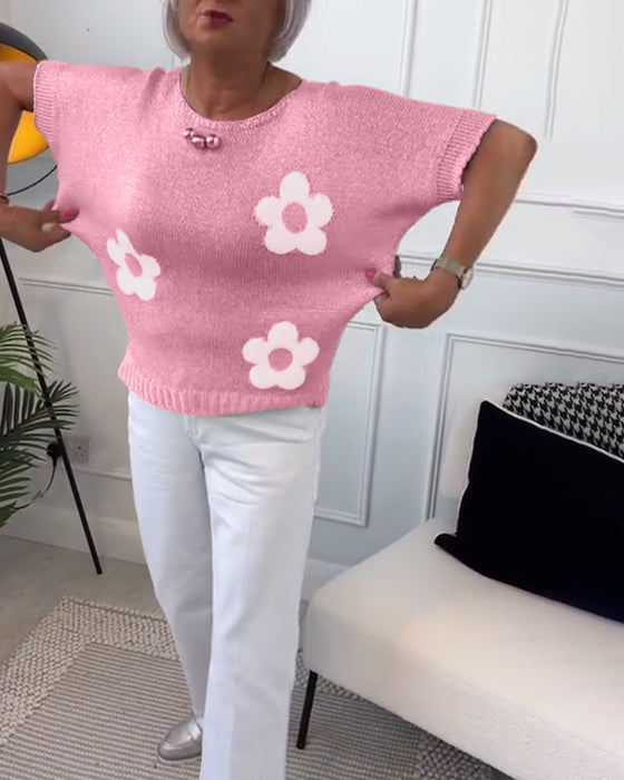 Wąski sweterek w kwiaty z okrągłym dekoltem