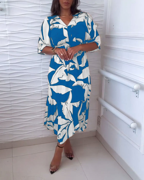 Elegancka sukienka z dekoltem w kształcie litery V i rękawami trzy czwarte