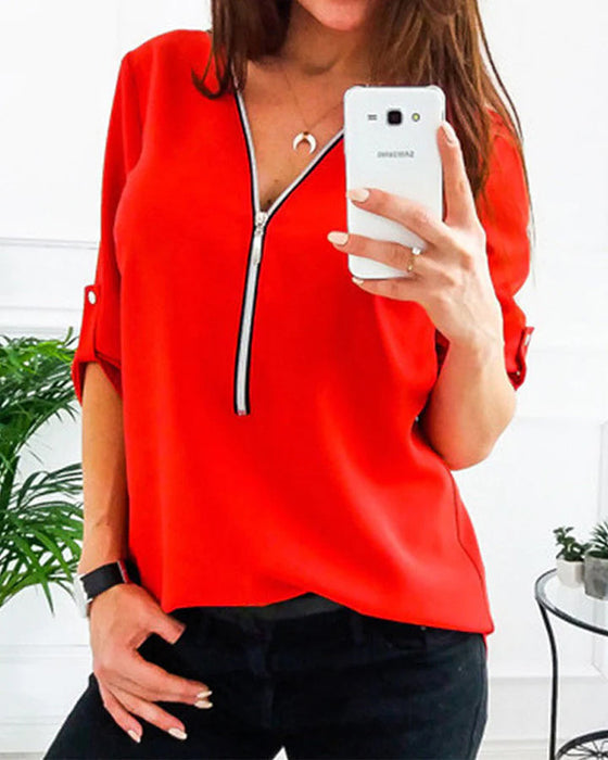 Solidna bluzka zapinana na zamek