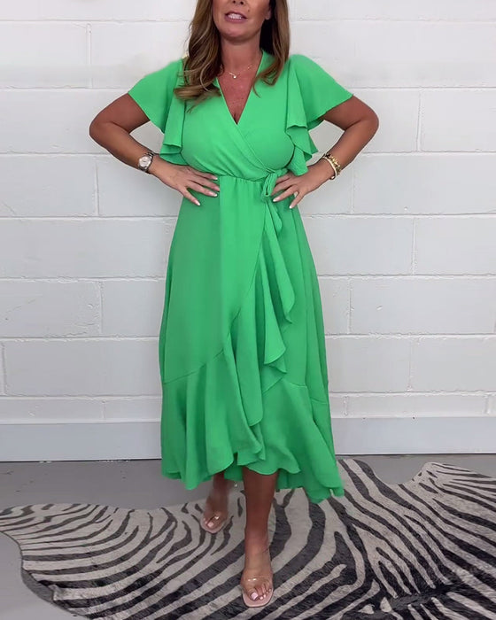 Elegancka sukienka z rozcięciem w jednolitym kolorze