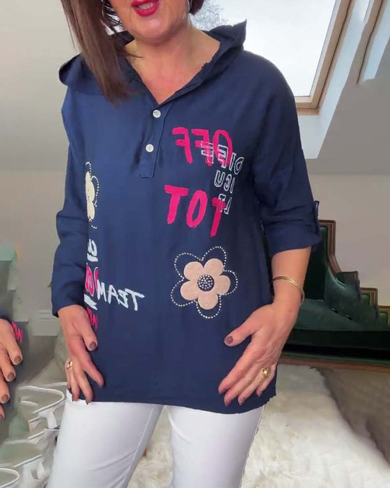 Luźna bluza z długim rękawem i haftowanym kwiatowym napisem