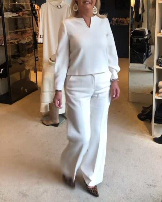 Elegancka bluzka w jednolitym kolorze z dekoltem w kształcie litery V