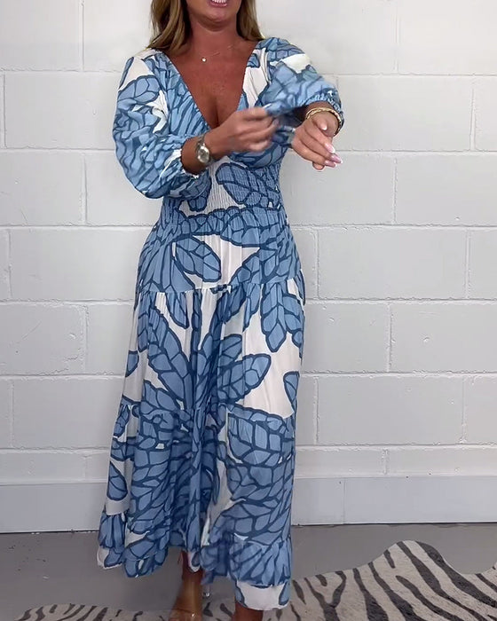 Długa damska sukienka z nadrukiem i dekoltem w kształcie litery V