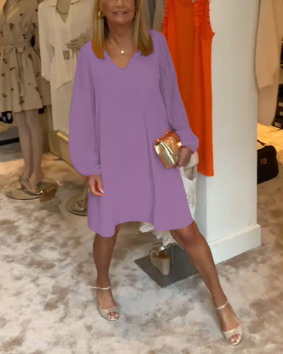 Sukienka w jednolitym kolorze z rękawami typu lampion i dekoltem w kształcie litery V