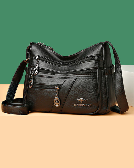 Wielokieszeniowa miękka skórzana torebka na ramię (crossbody)
