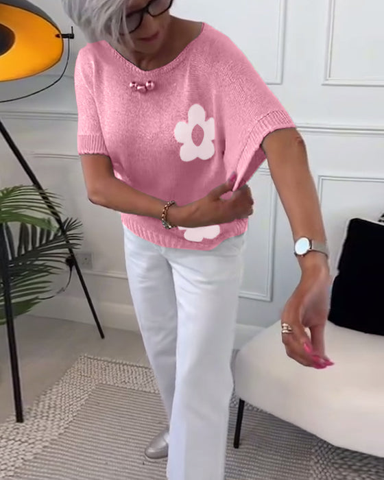 Wąski sweterek w kwiaty z okrągłym dekoltem