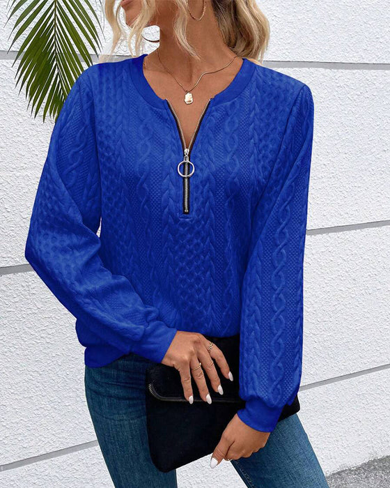 Luźna jednokolorowa bluza z długim rękawem i zamkiem błyskawicznym