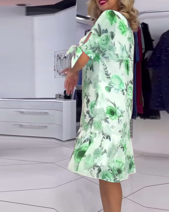 Elegancka sukienka w kwiaty z okrągłym dekoltem