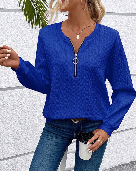 Luźna jednokolorowa bluza z długim rękawem i zamkiem błyskawicznym