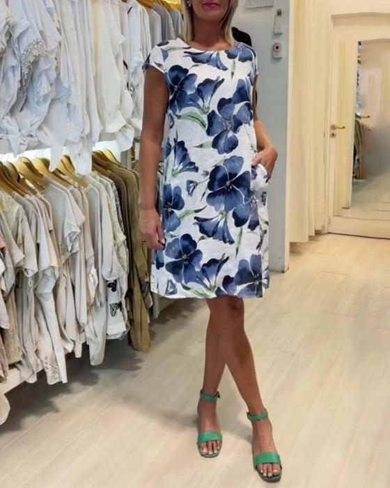 Sukienka z krótkim rękawkiem i kieszeniami w kwiatowy wzór