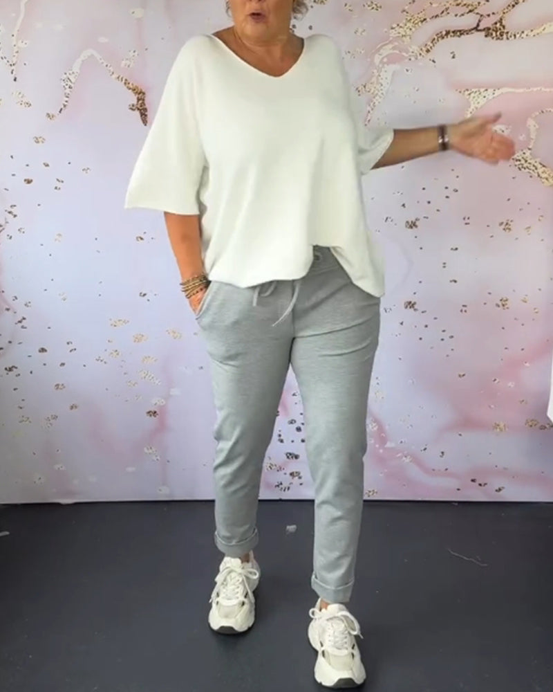 Spodnie casualowe w jednolitym kolorze z kieszeniami i ściągaczem