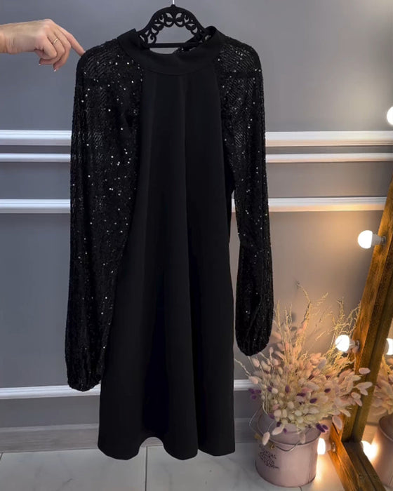 Sukienka w jednolitym kolorze z wstawkami na rękawach