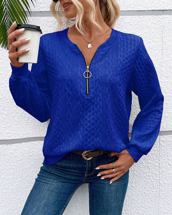 Luźna jednokolorowa bluza z długim rękawem i zamkiem błyskawicznym