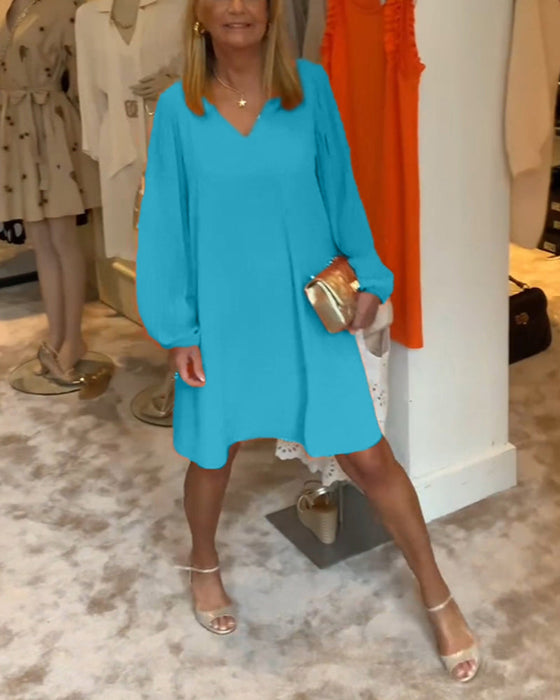 Sukienka w jednolitym kolorze z rękawami typu lampion i dekoltem w kształcie litery V