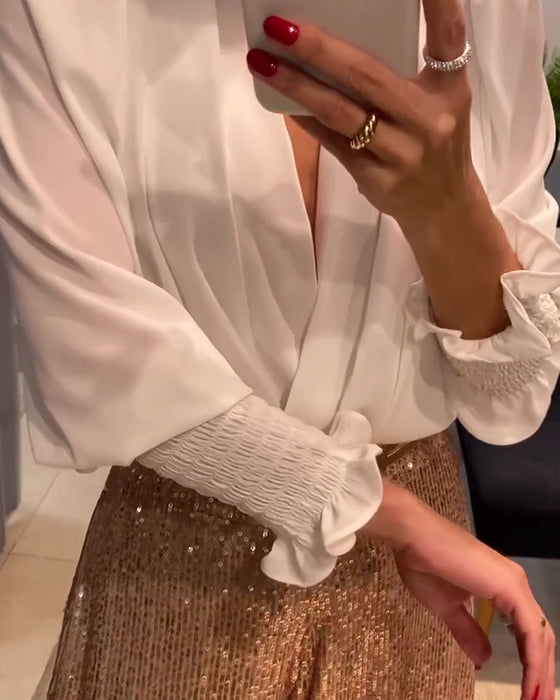 Elegancka bluzka w jednolitym kolorze z dekoltem w serek i rękawami