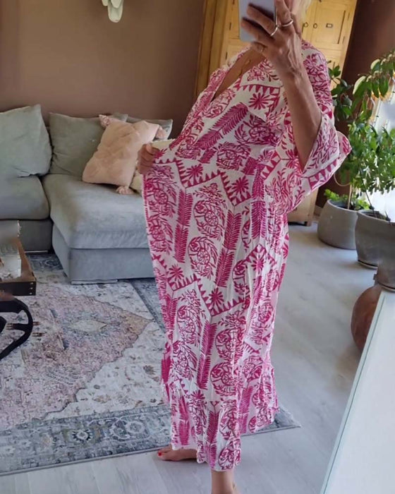 Elegancka sukienka z nadrukiem w kształcie litery V i rękawami typu dzwonek