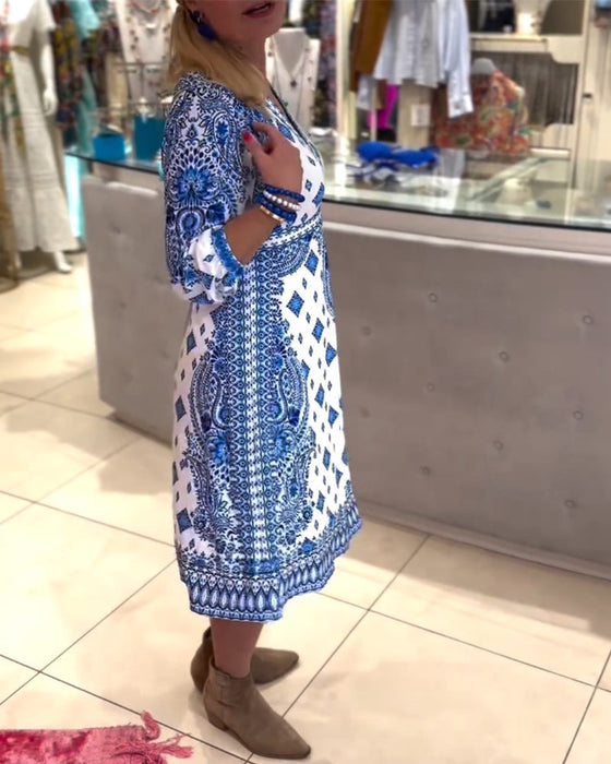 Elegancka sukienka midi z dekoltem w kształcie litery V